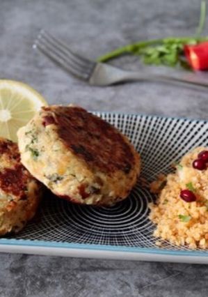 A picture of Smoked haddock Fish cake with pomegranate couscous.