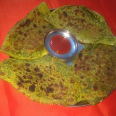 Spinach paneer stuffed paratha A picture of Spinach paneer stuffed paratha.