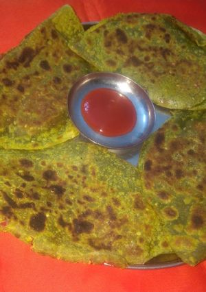 A picture of Spinach paneer stuffed paratha.
