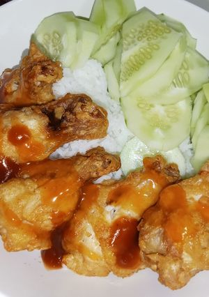 A picture of Fried Chicken Drumsticks with Ketchup.