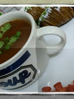 A picture of Healthy carrot soup with hasselback potatoes.