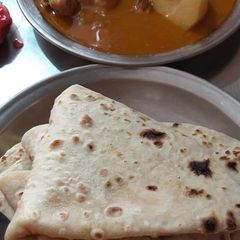 A picture of Korma with roti.