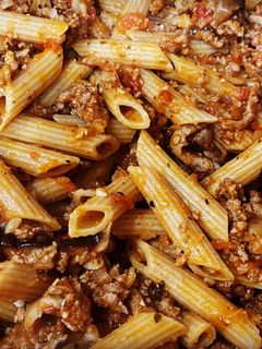A picture of Penne Pasta with Meat Sauce.