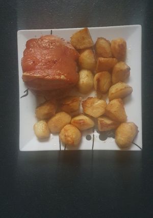 A picture of Pork joint and Roast Potatoes.
