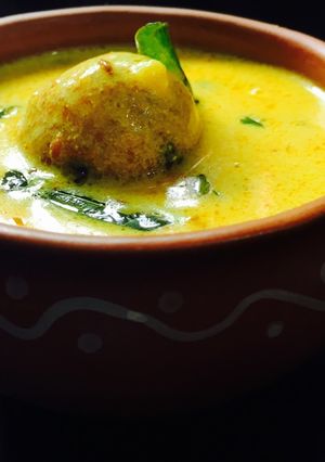 A picture of Paneer koftas in curd gravy.
