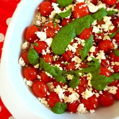 A picture of Blistered tomato, feta and basil & morogo pesto salad.