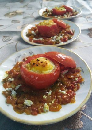 A picture of Baked egg in tomato cups.