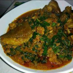 A picture of Banga with cocoyam soup and assorted meat.