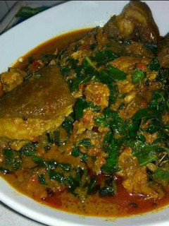 A picture of Banga with cocoyam soup and assorted meat.
