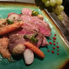 A picture of Stiploin steak with seasonal micro salad and horseradish sauce.