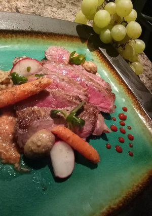 A picture of Stiploin steak with seasonal micro salad and horseradish sauce.