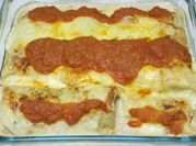 Una foto de canelones de pollo en bechamel