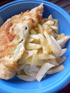 A picture of Fried potatoes with fried egg.