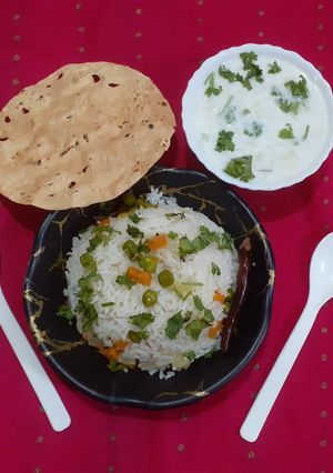 A picture of Biryani with Raita.