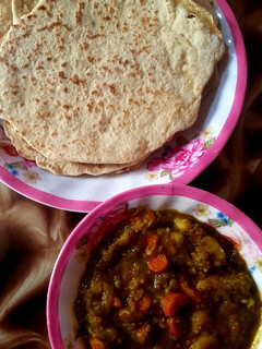 A picture of Roti and curry potatoes stew.