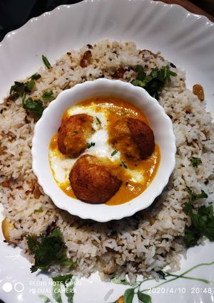 A picture of Malai kofta curry with dry fruits pulav.