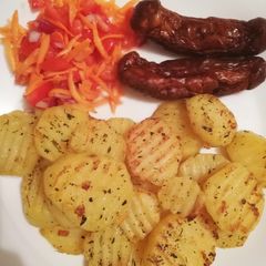 Seasoned potatoes, kachumbari & pork sausages A picture of Seasoned potatoes, kachumbari & pork sausages.