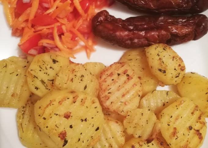 Seasoned potatoes, kachumbari & pork sausages