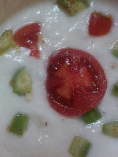 A picture of Tomato cucumber Raita.