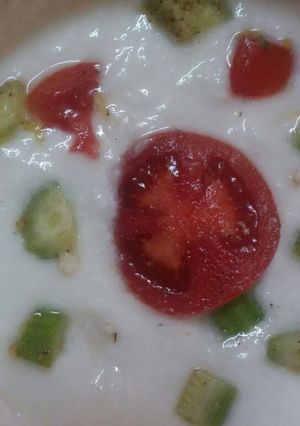 A picture of Tomato cucumber Raita.