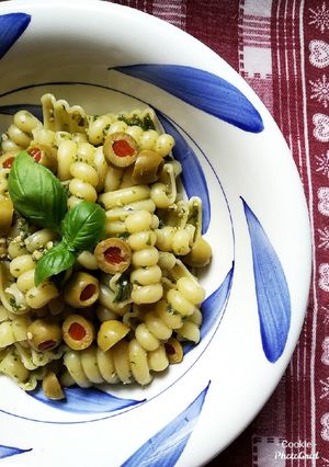 A picture of Cold Pasta with Basil-Almond Pesto and Olives.