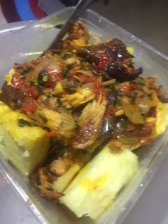 A picture of Boiled yam and palm oil pepper sauce.