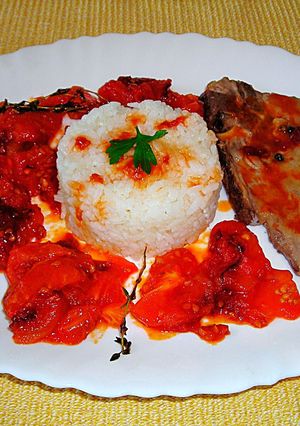 Foto principal de Chuleta de cerdo con mermelada de tomate y arroz blanco