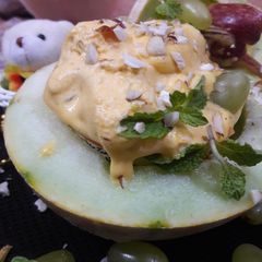 A picture of Low-Fat Melon Ice-Cream with Passion fruit and mint fruit salad.