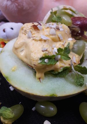 A picture of Low-Fat Melon Ice-Cream with Passion fruit and mint fruit salad.
