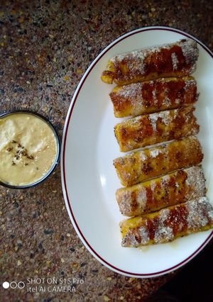 A picture of Banana French toast roll ups with peanut sauce. #breakfastideas.