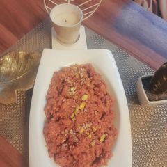 A picture of Gajar ka halwa with peels.