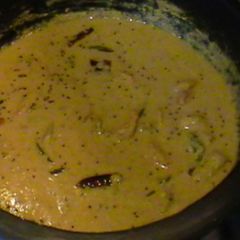 A picture of Shrimp in coconut sauce (Kerala style yellow shrimp Curry).