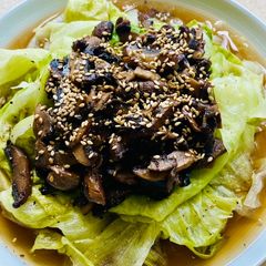 A picture of Lettuce with homemade pickled mushrooms.