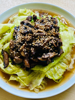 A picture of Lettuce with homemade pickled mushrooms.