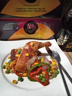 A picture of Golden chicken with veggies.