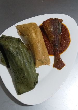 A picture of Leave moimoi with fried fish and stew.