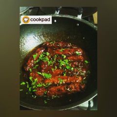 A picture of Afghani Kabab with siracha sauce.
