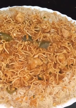 A picture of American chop suey with fried rice.