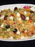 Whole wheat couscous salad with roasted peppers and feta cheese
