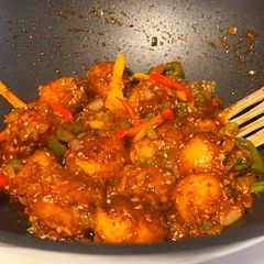 A picture of Schezwan potatoes.