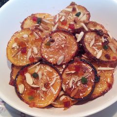 A picture of Orange Blast Malpuas with fresh halwa/rabri.
