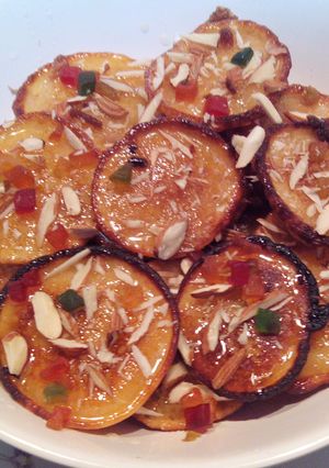 A picture of Orange Blast Malpuas with fresh halwa/rabri.