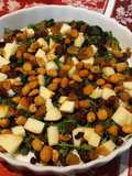 Wilted greens with apples, raisins & nuts