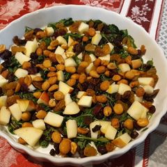 A picture of Wilted greens with apples, raisins & nuts.