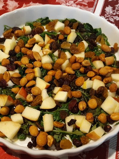 A picture of Wilted greens with apples, raisins & nuts.