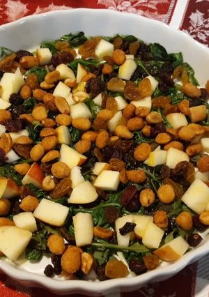 A picture of Wilted greens with apples, raisins & nuts.
