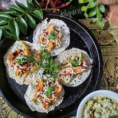 A picture of Chicken Sukka with Mini Dosa.