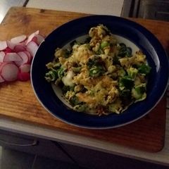 A picture of Eggs with onions and cheese.