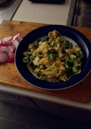 A picture of Eggs with onions and cheese.