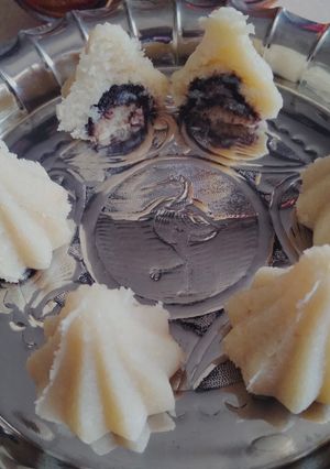 A picture of Coconut Modak filled with Apple ganache.